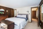 This bedroom has great views of the lake and direct access to the bathroom